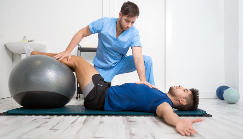 Physical therapist assisting a patient with rehabilitation exercises in Los Angeles